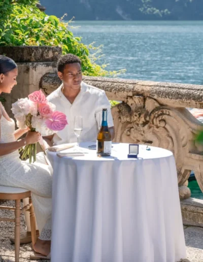Couple laughing after proposal in a Bellagio garden