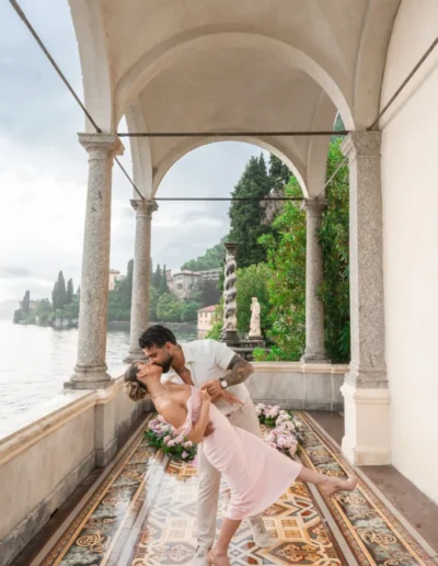 Couple walking hand-in-hand in the gardens of Villa Monastero