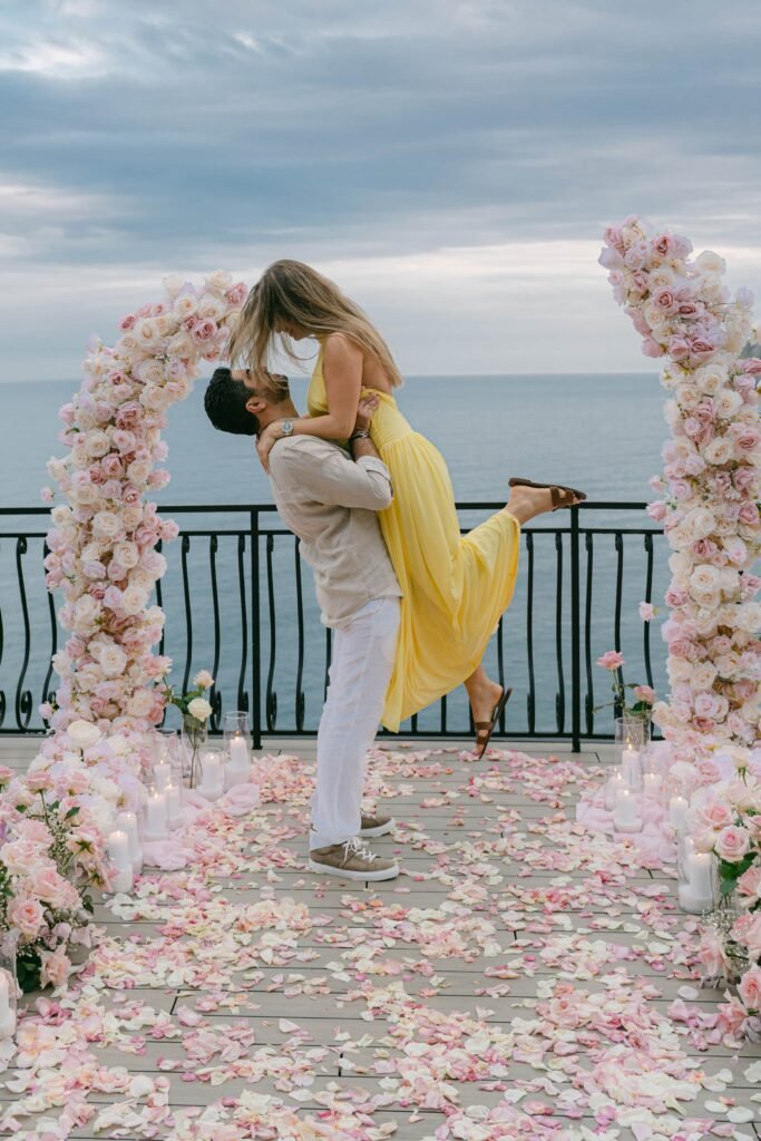 Nicole and Georgio after their proposal on the sea-view terrace at Porto Roca