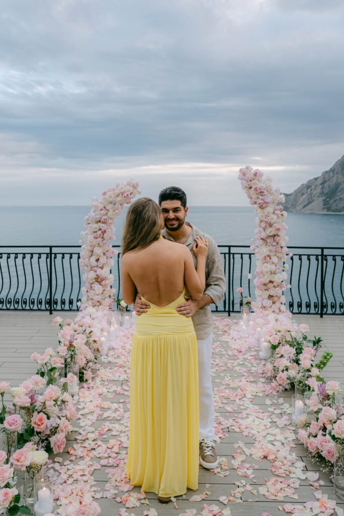Newly engaged couple surrounded by flowers during their Cinque Terre proposal